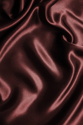 光滑的优雅的黑暗棕色（的）巧克力丝绸背景