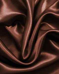 光滑的优雅的黑暗棕色（的）巧克力丝绸背景