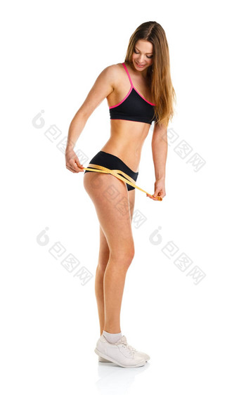 快乐运动女人测量完美的形状美丽的大腿