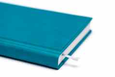 孤立的蓝色的笔记本白色