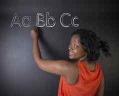 南非洲非洲美国女人老师学生学习字母写写作