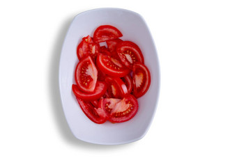 关闭切片红色的西红柿白色碗