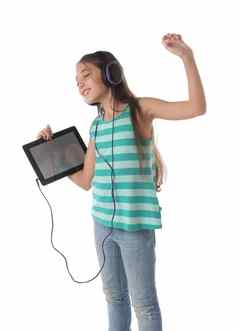 美丽的青少年女孩跳舞平板电脑耳机