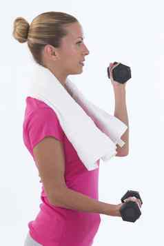 适合锻炼体育运动女人哑铃健身房