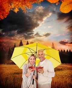 复合图像肖像快乐夫妇黄色的伞