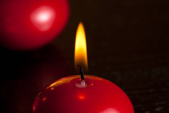 细节红色的圣诞节蜡烛温暖的色彩光背景