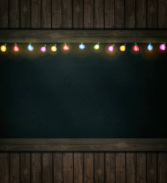 圣诞节灯木黑板上