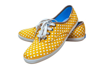 一对运动鞋古董点黄色的颜色孤立的白色引入