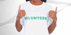 复合图像女人穿志愿者T恤给拇指