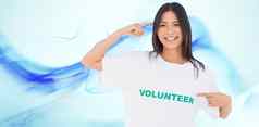 复合图像微笑女人指出志愿者T恤