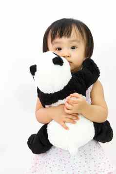 中国人女孩持有熊猫玩具