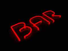 酒吧红色的霓虹灯标志孤立的黑色的背景