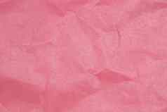 皱巴巴的纸纹理粉红色的纸表