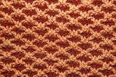 棕色（的）针织布使手