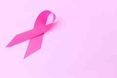 粉红色的丝带粉红色的背景意识乳房癌症概念