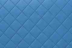 细节蓝色的缝皮革蓝色的皮革室内装潢背景模式