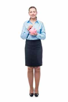 年轻的成功的女商人粉红色的小猪银行白色