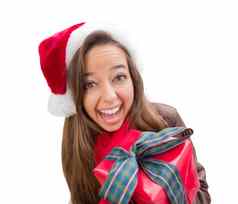 女孩穿圣诞节圣诞老人他弓包装礼物孤立的白色