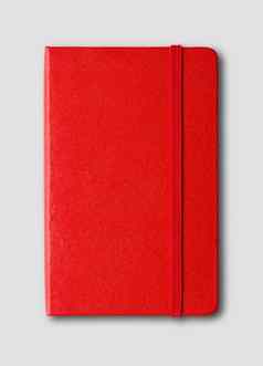 红色的关闭笔记本孤立的灰色