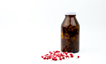 红色的白色抗生素胶囊药片琥珀色的玻璃瓶孤立的白色背景复制空间空白标签药物电阻抗生素药物合理的制药行业药店背景全球医疗保健抗菌药物过度使用