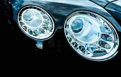 特写镜头细节领导头灯奢侈品车美丽的现代优雅头灯车黑色的汽车汽车行业技术汽车部分业务概念