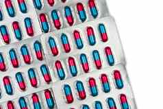 色彩斑斓的蓝色的粉红色的胶囊颗粒一边药片药片泡包白色背景空间制药剂量形式包装抗真菌医学