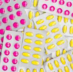 前视图粉红色的黄色的平板电脑药丸泡包非甾体抗炎药恼怒的胃胃溃疡药片救援疼痛期抽筋头疼牙痛