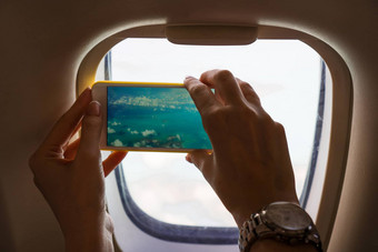 美丽的完美的视图异国情调的岛屿绿松石水飞机图片采取电话