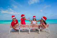 快乐家庭圣诞节帽子有趣的白色海滩