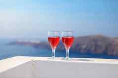 眼镜美味的红色的酒日落希腊
