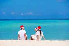 快乐家庭圣诞老人帽子海滩圣诞节假期