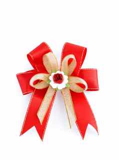 红色的礼物弓装饰孤立的白色