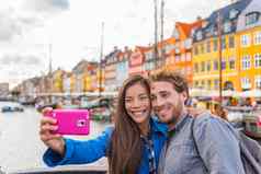 哥本哈根旅行夫妇游客采取自拍照片电话相机微笑年轻的人学生港口新端口旅游丹麦具有里程碑意义的丹麦北部欧洲