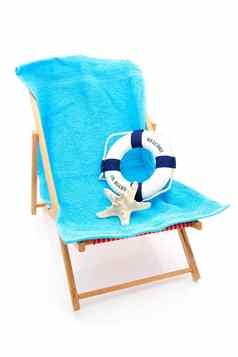 海滩椅子蓝色的毛巾生活浮标