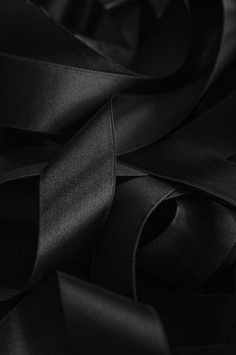黑色的丝绸丝带背景摘要奢侈品品牌设计