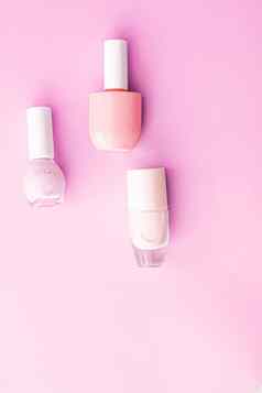 指甲波兰的瓶粉红色的背景美品牌