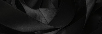 黑色的丝绸丝带背景摘要奢侈品品牌设计