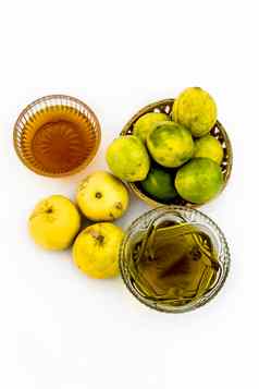 负担得起的头发护发素孤立的白色柠檬汁混合蜂蜜橄榄石油柠檬蜂蜜现在表面