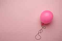 膨胀的粉红色的气球粉红色的背景的地方inscrip