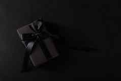 礼物盒子包装黑色的纸黑色的弓丝带