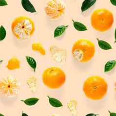 普通话无缝的模式橘子克莱门泰孤立的橙色背景绿色叶子集合细无缝的模式