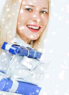 圣诞节惊喜闪闪发光的雪背景快乐金发女郎吉尔