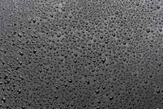 水滴摘要平黑色的疏水表面宏背景