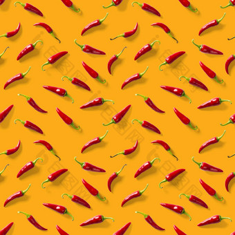 无缝的模式使红色的辣椒辣椒橙色背景最小的食物模式红色的热辣椒无缝的辣椒模式食物背景