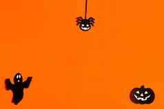 轮廓鬼蜘蛛南瓜使黑色的纸橙色背景万圣节概念现成的布局空间文本复制空间平躺设计