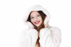 年轻的女人毛茸茸的皮毛外套罩包装温暖的冬天布