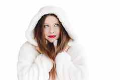 年轻的女人毛茸茸的皮毛外套罩包装温暖的冬天布