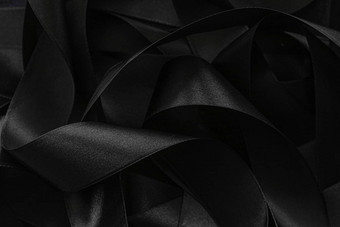黑色的丝绸丝带背景摘要奢侈品品牌desig