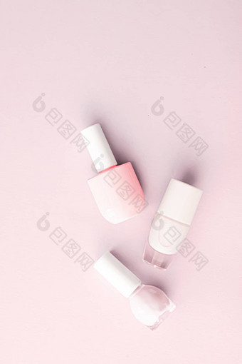 指甲波兰的瓶脸红粉红色的背景美品牌