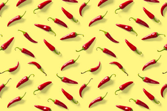 有创意的背景使红色的辣椒辣椒黄色的背景最小的食物背景红色的热辣椒辣椒背景
